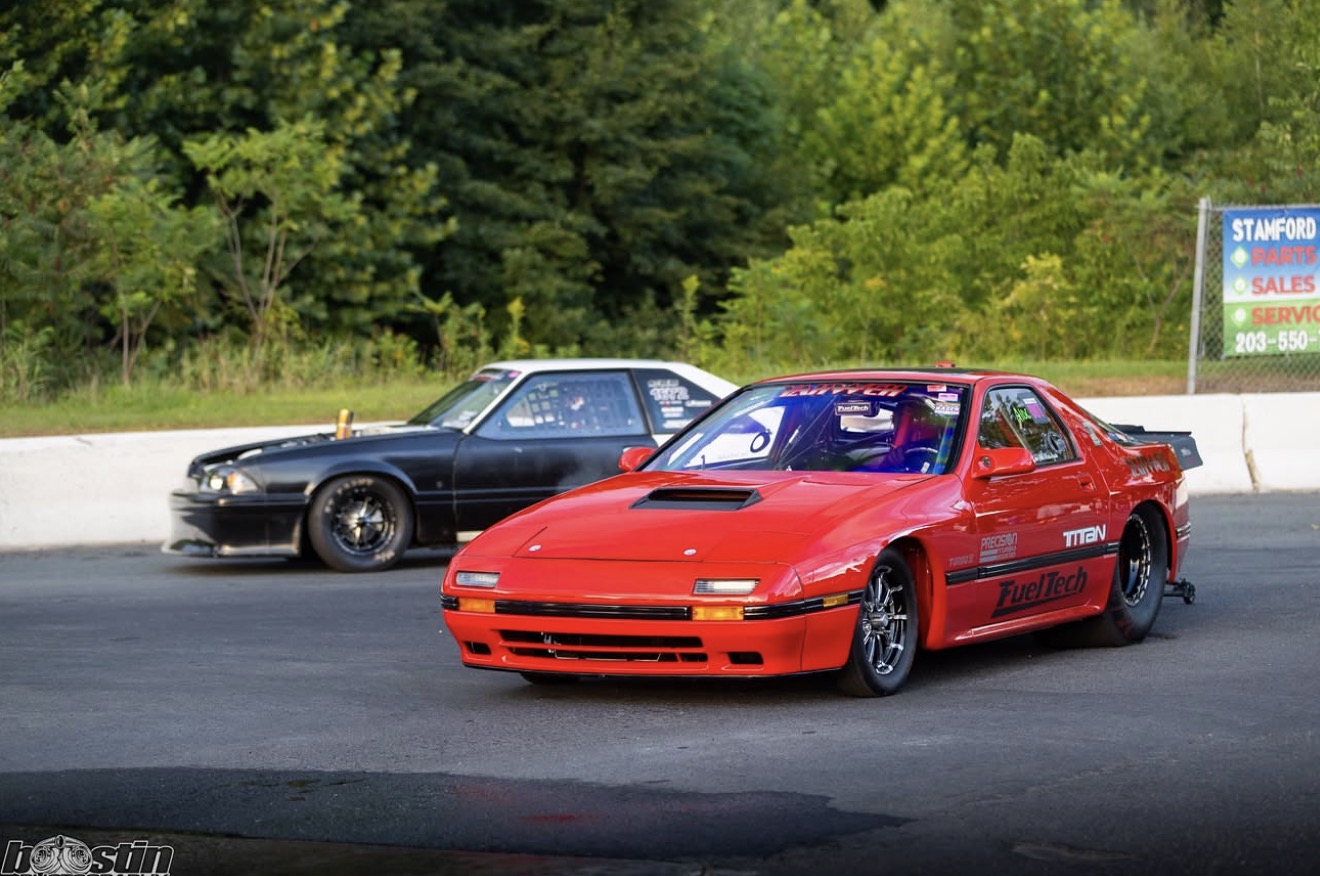Two import race cars lining up at the drag strip